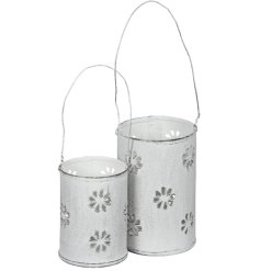 Light up your garden with this elegant white metal hanging lantern set for a charming ambiance.