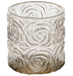 a clear glass swirl design tea light holder 