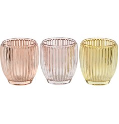 Add elegance and warmth to your home with multi-coloured glass candle holders,
