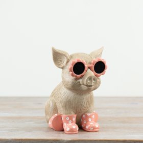 Cute resin pig with pink highlights, trendy glasses, and vibrant wellies in natural shades.