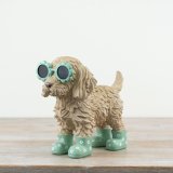  a charming Cockapoo figurine, featuring quirky flower-shaped glasses 