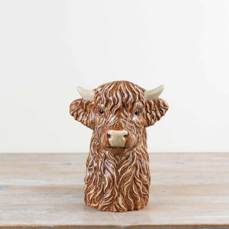 Rustic Scottish Highland Cow ceramic vase combining charm and functionality with unique design.