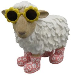 Cheerful sheep ornament wearing sunglasses and rain boots, perfect for a playful touch.
