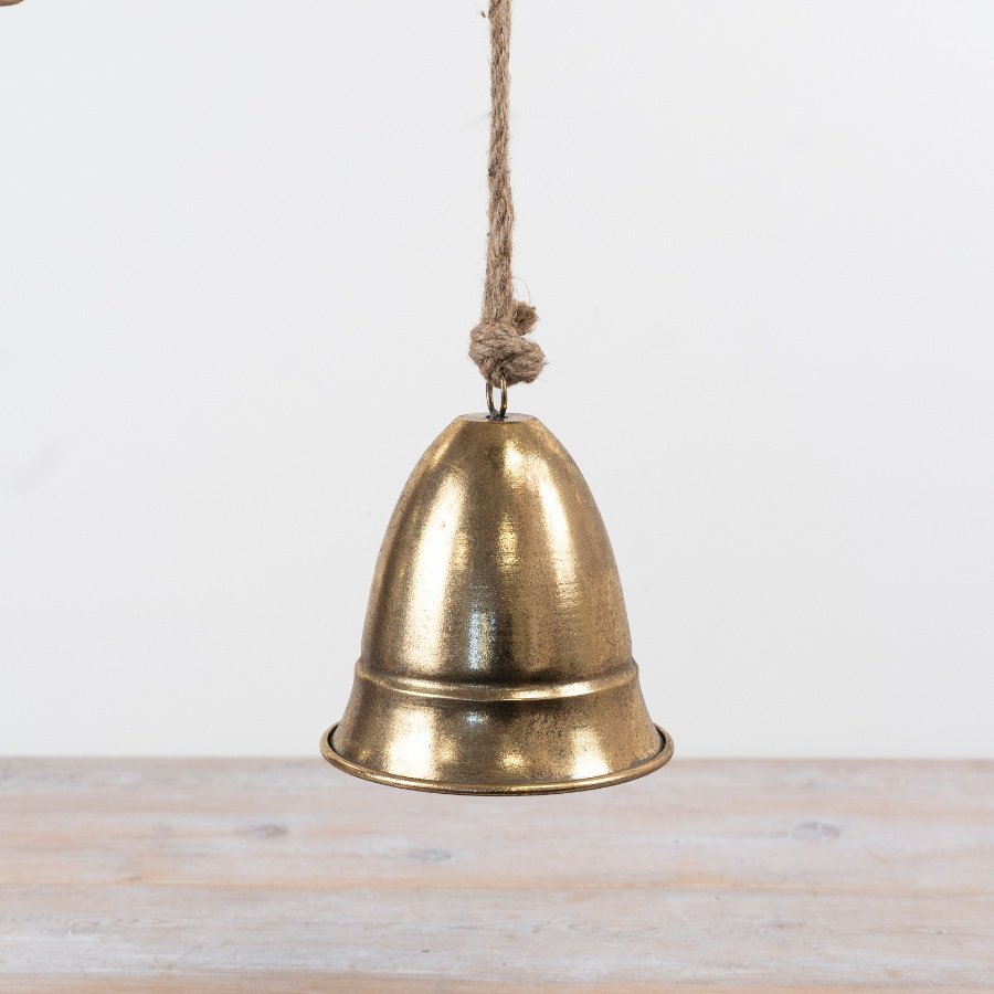 A timeless metal bell decoration with a vintage aesthetic. Complete with a chunky rope hanger.