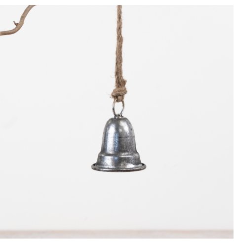 A compact metal bell finished in brushed silver and suspended from natural jute rope. 