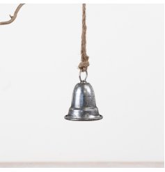 A small hanging metal bell in a classic silver finish with jute string detail