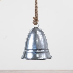 A brushed silver metal bell hung from jute string.