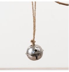 Metal hanging bell with a distressed silver finish and star-shaped cut-out designs for decorative charm.