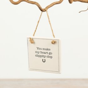 Adorable sign showcasing the heartfelt phrase "You Make My Heart Go Clippity Clop."