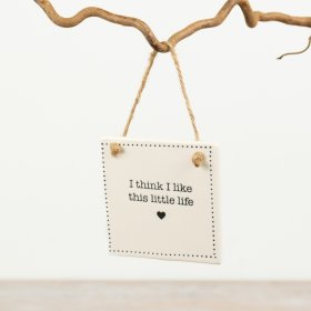 This hanging sign showcases a touching phrase and is a perfect addition to any space.