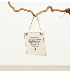 a charming porcelain hanging sign 