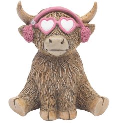 a fun highland cow with sunglasses and ear moofs figurine 