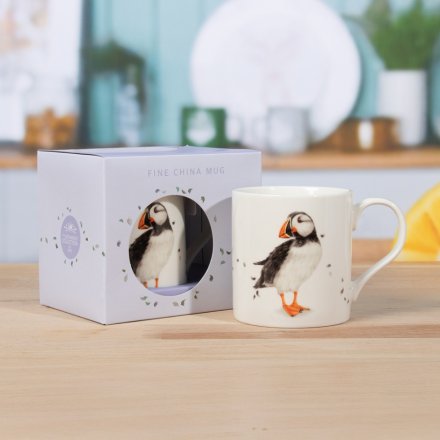 Charming puffin themed mug perfect for savouring your coffee or tea.