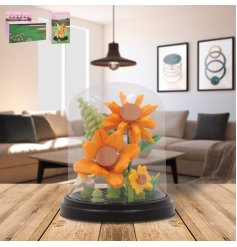 Vibrant mini sunflower bricks enclosed in a clear plastic dome display.