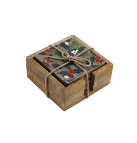 Set of 4 wooden festive coasters featuring enamel designs of Christmas berries and mistletoe.