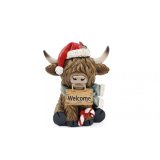 Add a cozy, Scottish touch to your holiday décor with this adorable cow deco