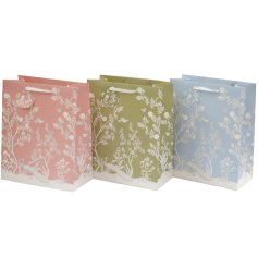Elegantly package your presents with these charming secret garden-themed gift bags.