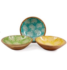 Elegant collection of serving bowls featuring palm-inspired designs.