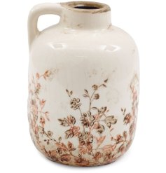 Add elegance to any space with this floral vase with handle