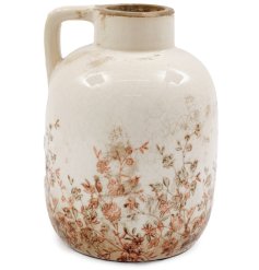 Add a charming rustic touch to any room with this 16x20.5cm floral vase with handle