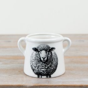 Adorable planter pot featuring a cute sheep design.