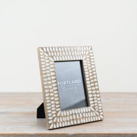 Chic wooden rustic frame with a unique patterned design.