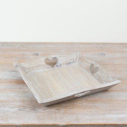 Rustic wooden tray shaped like a heart, perfect for serving or display.