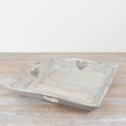 Lovely wooden tray featuring heart-shaped cut-out designs.