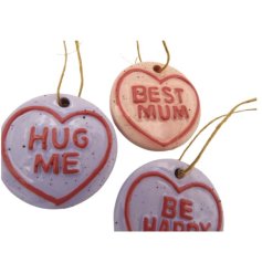 Decorate with this 4cm Ceramic Love Heart Hanging Ornament, showcasing a sweet message and vibrant design.