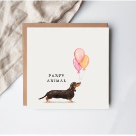 Celebrate in style with the Party Animal Greeting Card—featuring a cheerful dog and vibrant colors, perfect for any fe