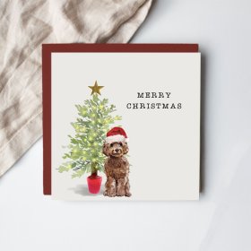 Say Merry Christmas with this adorable greetings card featuring a cockapoo wearing a Santa hat. 