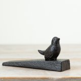 Keep your doors securely open with this charming cast iron Bird Door Stopper