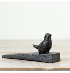 Secure doors in style with this charming cast iron Bird Door Stopper.