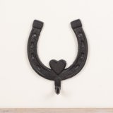View Cast Iron Horseshoe w Hook, 15.2cm Details a rustic horseshoe hook with heat detailing