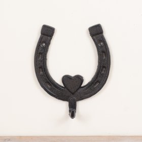 Rustic horseshoe hook featuring heat accents for a vintage look.