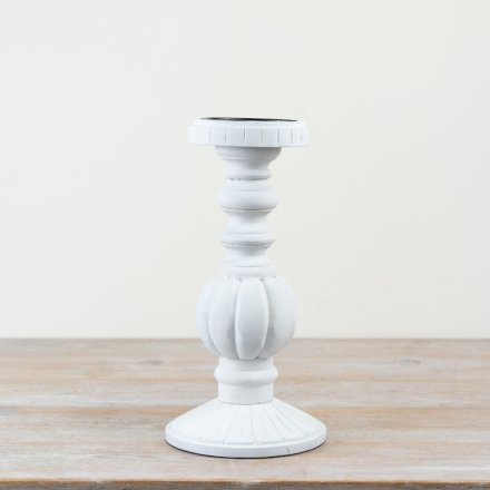Chic candle holder crafted from wood and iron for a timeless look.