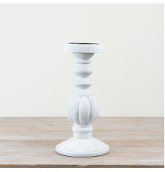 Chic candle holder crafted from wood and iron for a timeless look.