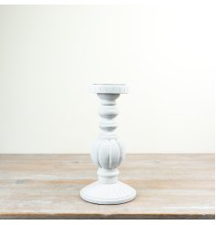 Chic candle holder crafted from wood and iron for a timeless look.