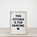 Add a charming touch to your kitchen with the "Kitchen Dancing" wooden sign