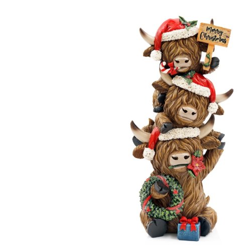 Adorable Highland cow stack holding a festive Merry Christmas sign.