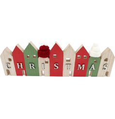 Bring holiday cheer with these charming Christmas House decorations.