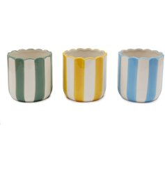 A colourful striped planter with curved edges 