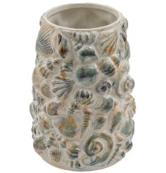 A delightful vase inspired by sea shells, perfect for seaside décor.