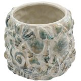 add a coastal charm to your home with this shell plant pot 