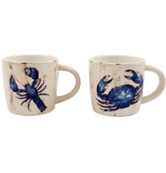 Sip in style with this charming  porcelain mug, adorned with delicate blue and white Sealife illustrations 