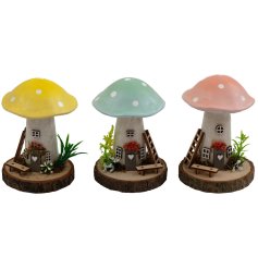 Charming wooden toadstool house ornament perfect for home décor.