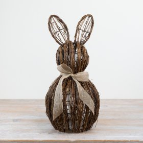 Rattan bunny figurine seated, adorned with an adorable bow.