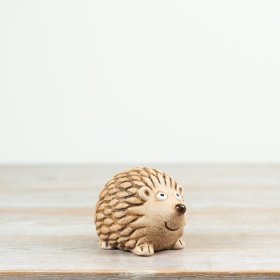 Adorable resin hedgehog decoration for a cute touch to any space.