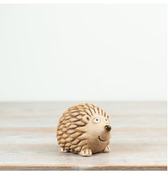 Adorable resin hedgehog decoration perfect for adding charm to any space.