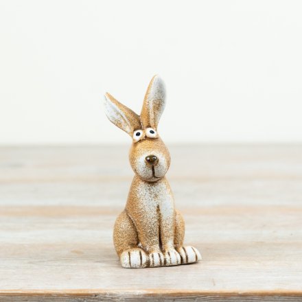 A cheerful rabbit ornament with big eyes and a smiling face.